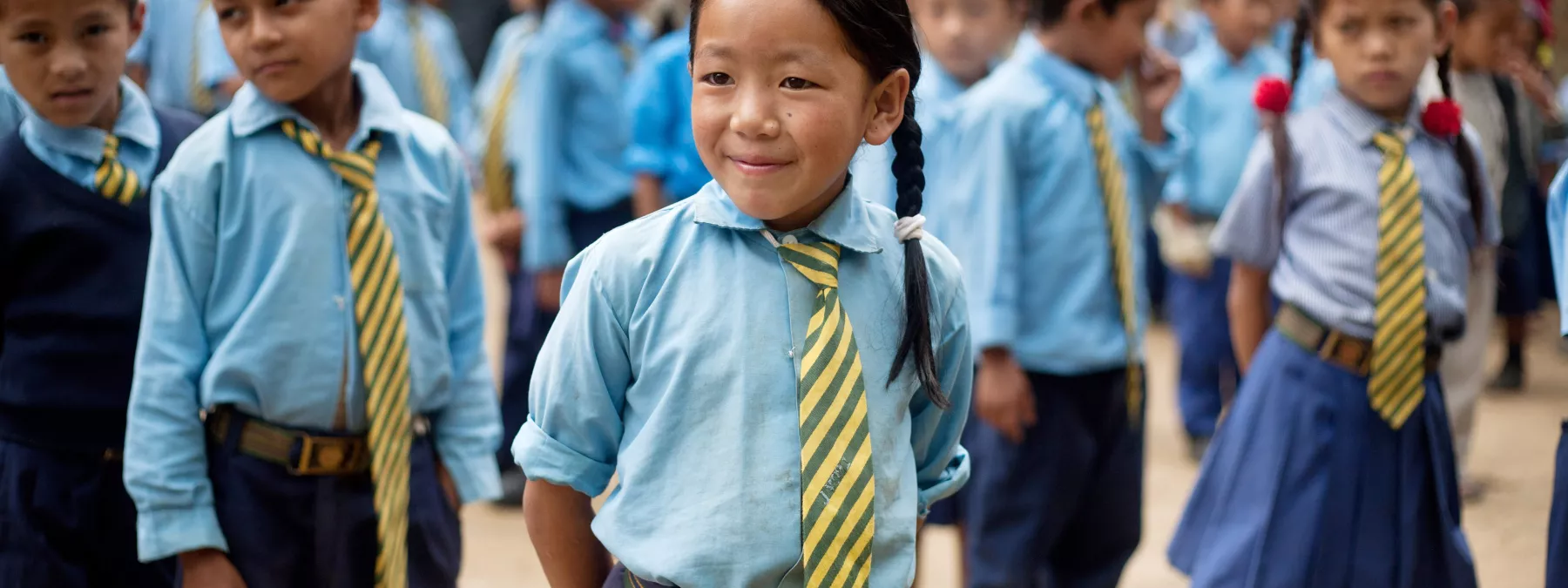 Sanju Rai, 9, during the morning assembly in the school in Nepal
